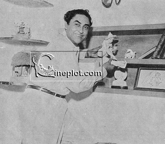 Ashok with his fine collection of curios displayed in a corner of his well-furnished apartment home.